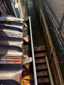 Gutters Filled With Debris with cautions to overflowing
