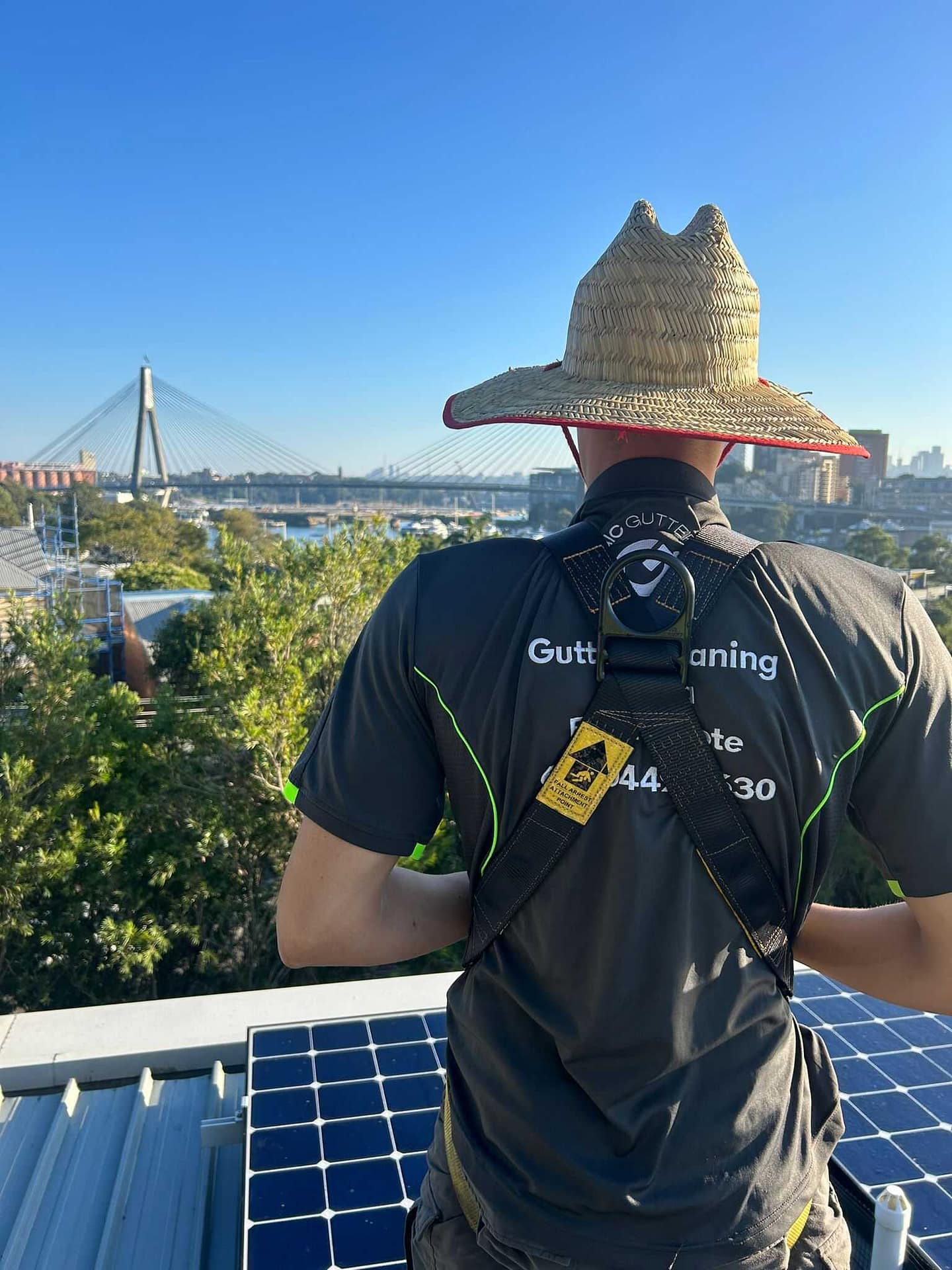 Magic Gutter technician working safely on a Sydney roof